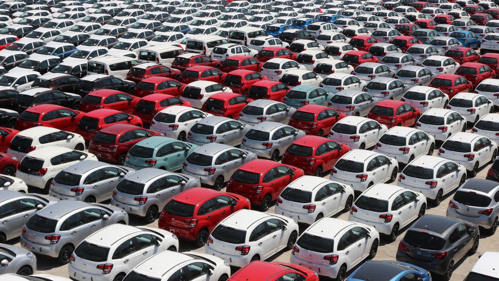 Rows of parked cars in a large lot